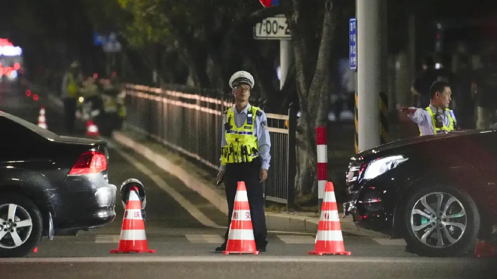 Crowd and emergency responders after SUV attack in Zhuhai, China